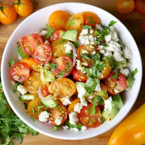 aerial shot of cherry tomato in a white ceramic bowl
