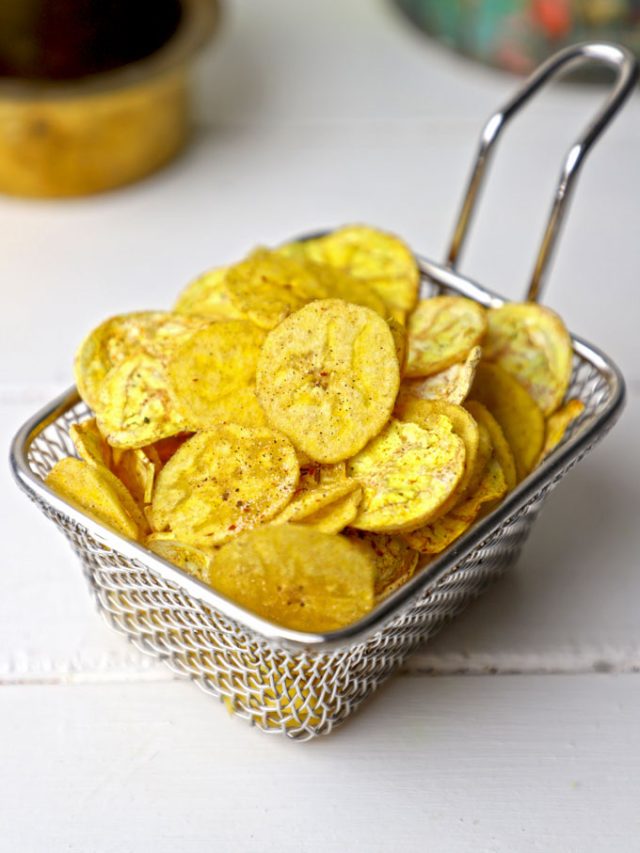 side shot of banana chips stacked on a wire basket
