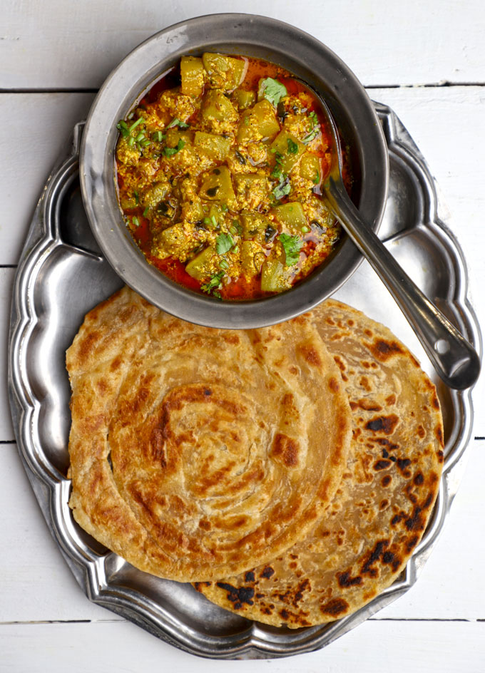 Indian thali with dahi lauki sabji and paratha