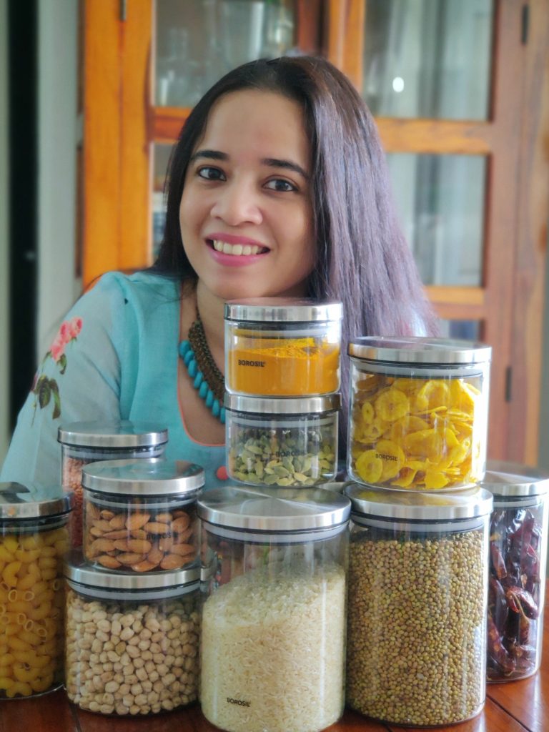 portrait shot of Hina Gujral in her kitchen.