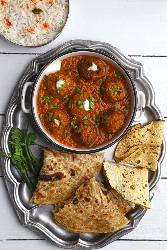 indian thali with lauki kofta curry and paratha