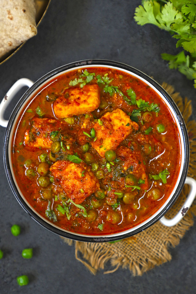 aerial shot of matar paneer in a white bowl