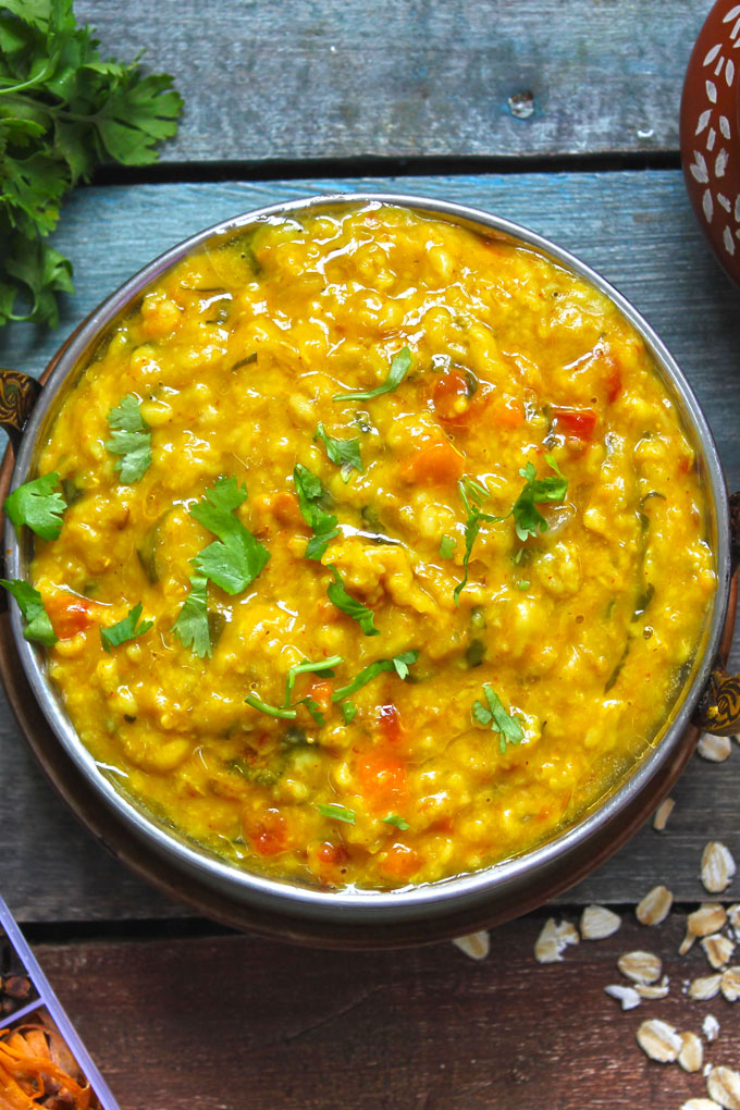 aerial shot of oats khichdi in a serving bowl