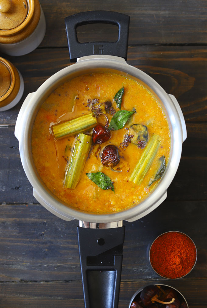 aerial shot of vegetable sambar in a pressure cooker