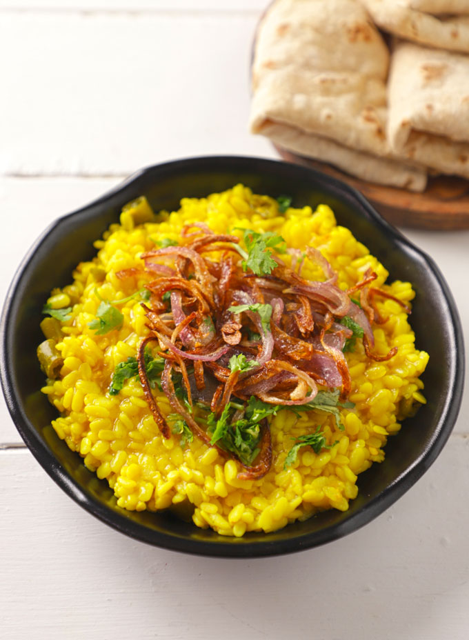 side shot of Punjabi sookhi urad dal served on a black platter